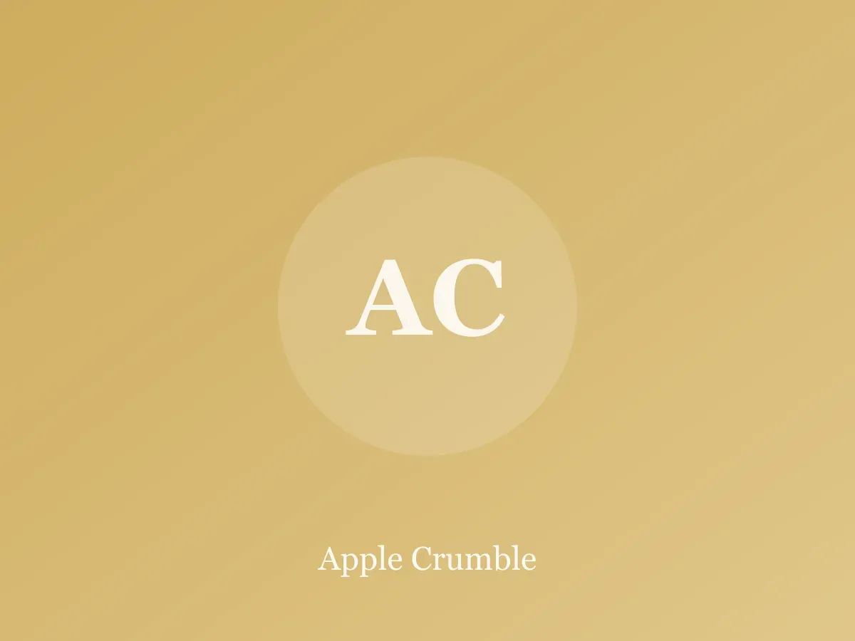 Dish of apple crumble with golden oat topping and a serving spoon