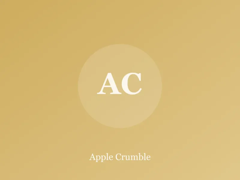Dish of apple crumble with golden oat topping and a serving spoon