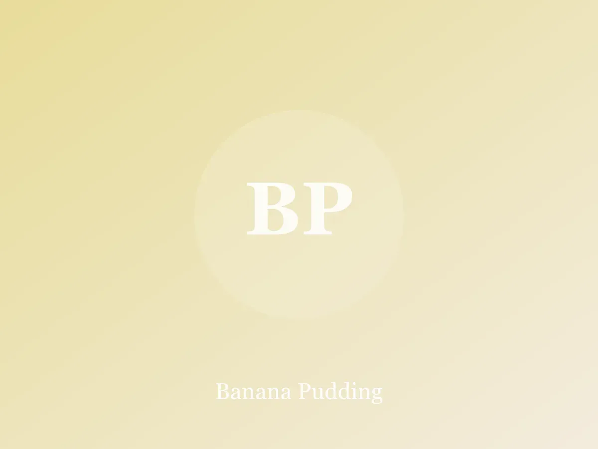 Glass dish of banana pudding with layers of custard, banana slices and vanilla wafers