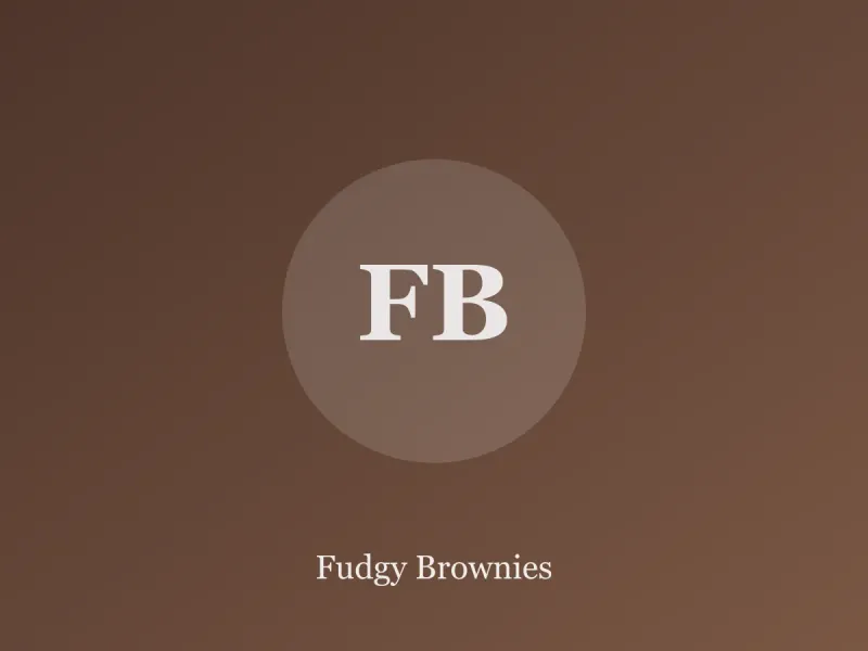 Stack of fudgy brownies with shiny crackly tops on parchment